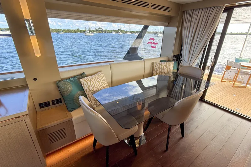 Slide: The Image of Luxurious interior of 2023 Sirena 68 yacht with elegant dining area and scenic ocean view. - 29