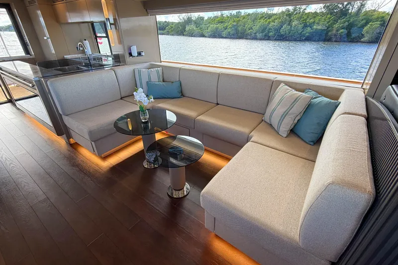 Slide: The Image of Luxurious interior of 2023 Sirena 68 yacht with elegant seating and scenic water view. - 31