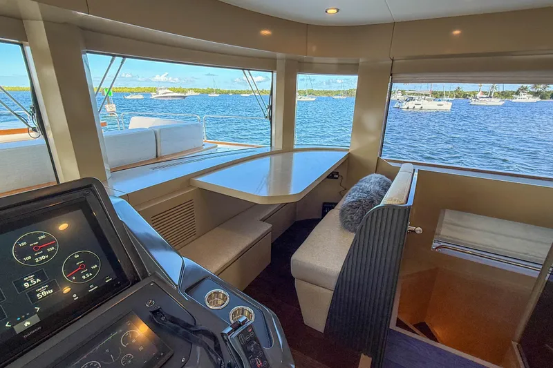 Slide: The Image of Interior of 2023 Sirena 68 yacht with helm, seating, and ocean view. - 34