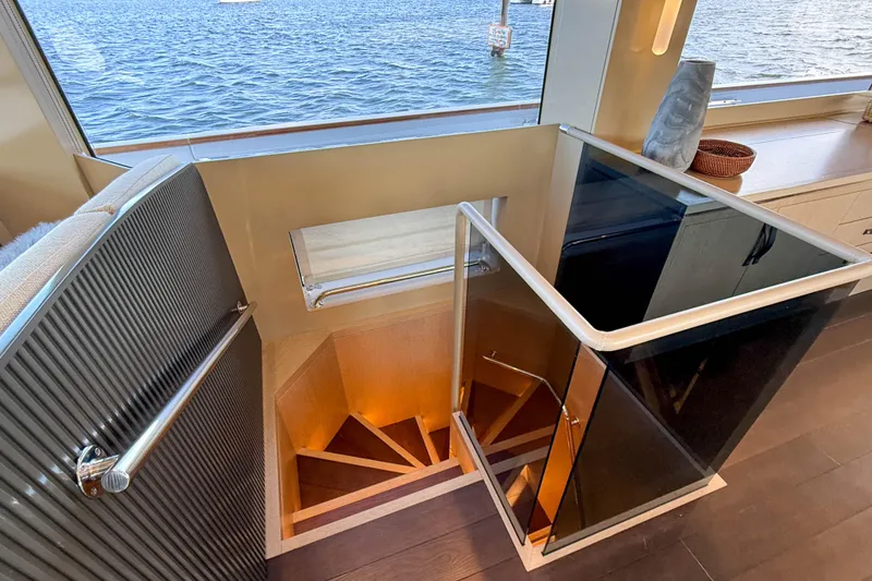 Slide: The Image of Interior staircase of 2023 Sirena 68 yacht with ocean view. - 38