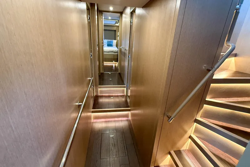 Slide: The Image of Luxurious interior hallway of 2023 Sirena 68 yacht with wooden finishes and modern lighting. - 39
