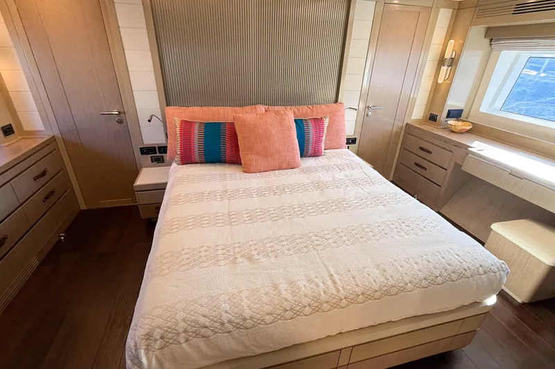 Slide: The Image of Luxurious bedroom interior of 2023 Sirena 68 yacht with elegant decor and natural light. - 40
