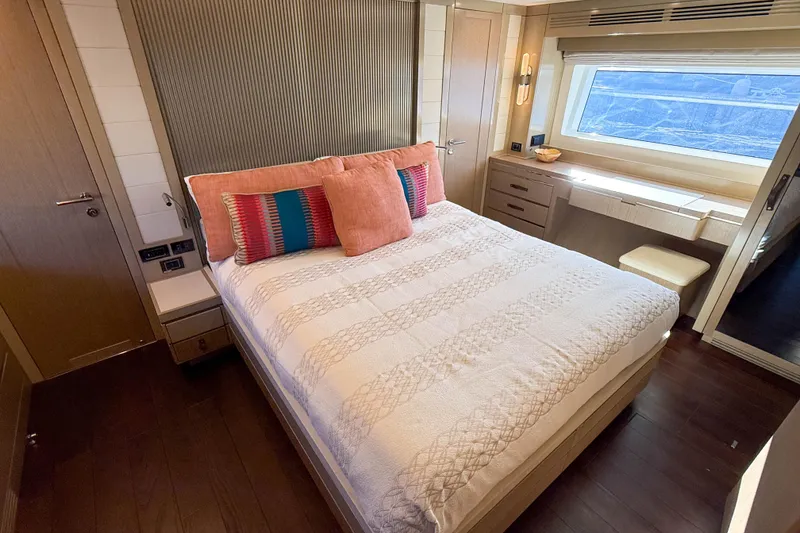 Slide: The Image of Luxurious bedroom interior of 2023 Sirena 68 yacht with elegant decor and large window. - 42