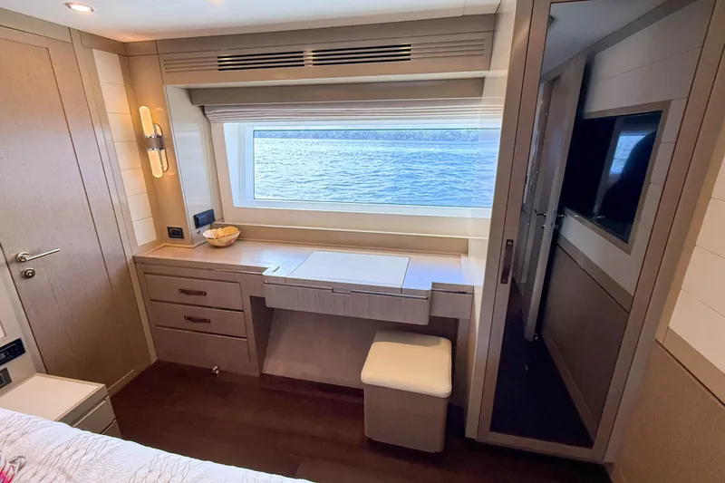 Slide: The Image of Luxurious interior of 2023 Sirena 68 yacht with ocean view window and elegant furnishings. - 43