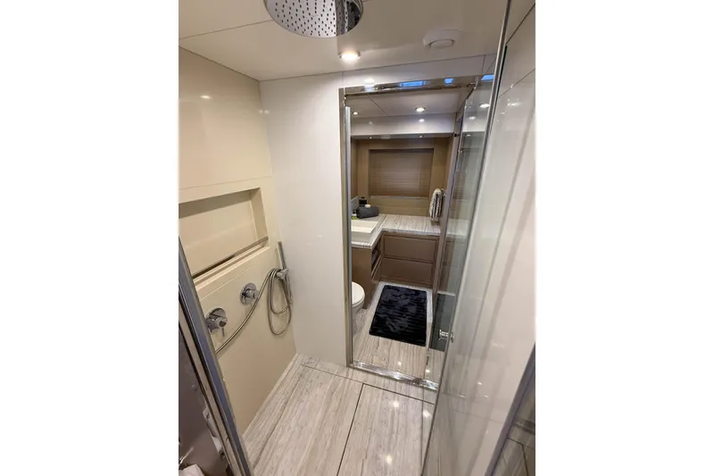 Slide: The Image of Luxurious bathroom interior of 2023 Sirena 68 yacht, featuring modern fixtures and elegant design. - 46