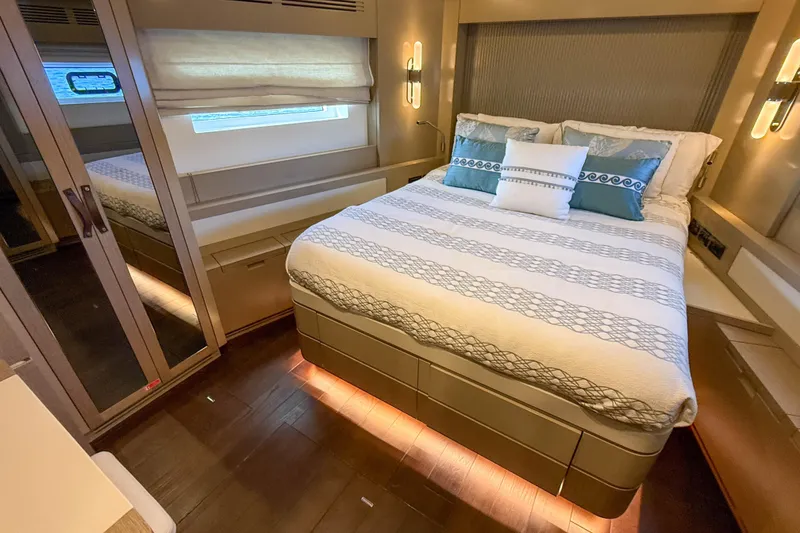 Slide: The Image of Luxurious bedroom interior of 2023 Sirena 68 yacht with elegant bedding and ambient lighting. - 48