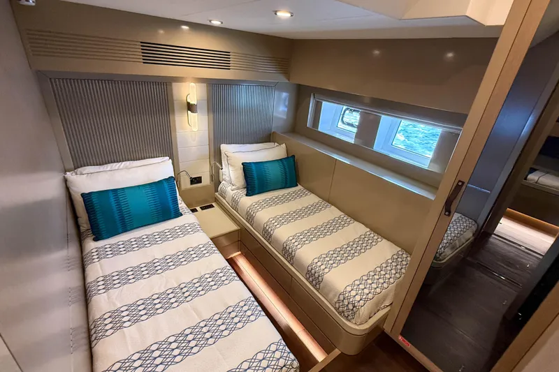 Slide: The Image of Luxurious 2023 Sirena 68 yacht cabin with twin beds and modern decor. - 52