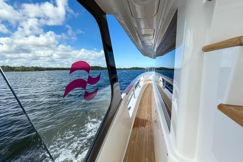 Slide: The Image of 2023 Sirena 68 yacht deck with ocean view and clear skies. - 59
