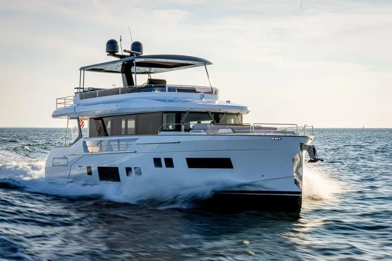 Slide: The Image of 2023 Sirena 68 yacht cruising on open water. - 6