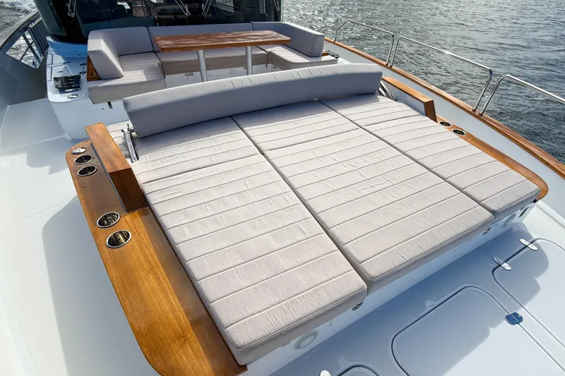 Slide: The Image of Luxurious 2023 Sirena 68 yacht deck with spacious sunbathing area and elegant seating. - 60