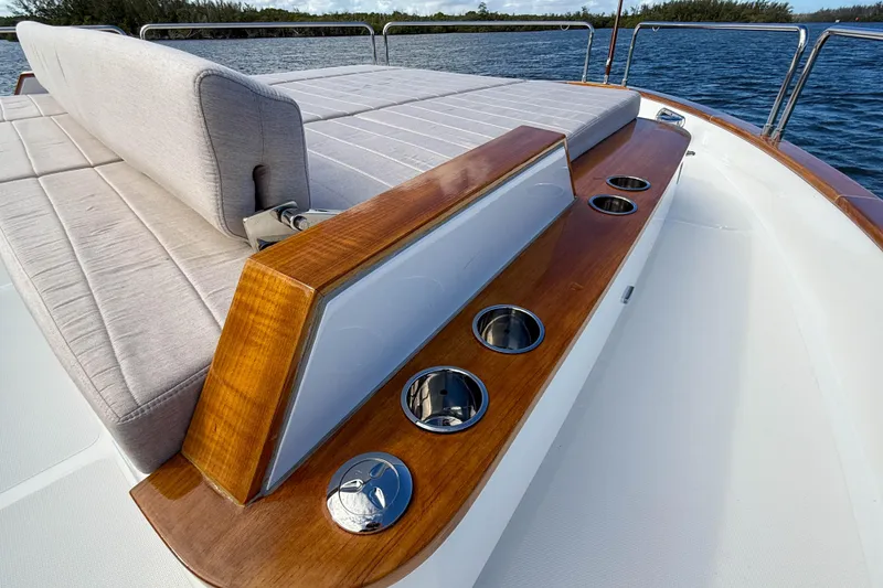 Slide: The Image of Luxurious deck of 2023 Sirena 68 yacht with cushioned seating and cup holders. - 61