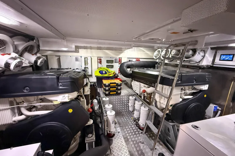Slide: The Image of Engine room of 2023 Sirena 68 yacht, featuring dual engines and modern equipment. - 68