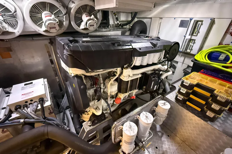 Slide: The Image of Engine room of 2023 Sirena 68 yacht with visible machinery and equipment. - 69