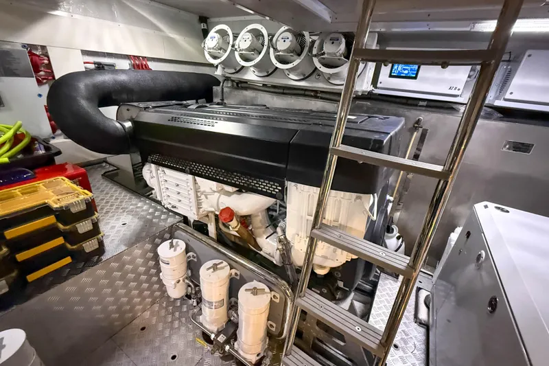 Slide: The Image of Engine room of 2023 Sirena 68 yacht, featuring advanced machinery and equipment. - 70