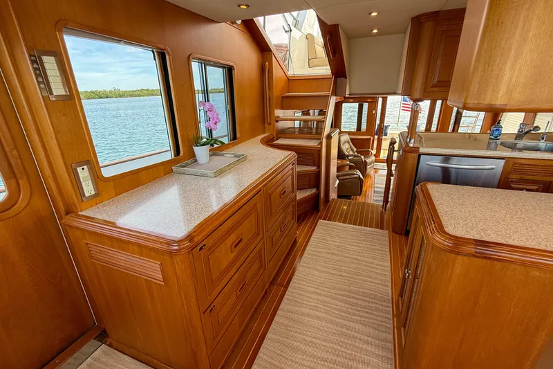 Slide: The Image of Luxurious interior of 2003 Grand Banks 64 Aleutian RP yacht with wooden cabinetry and staircase. - 26