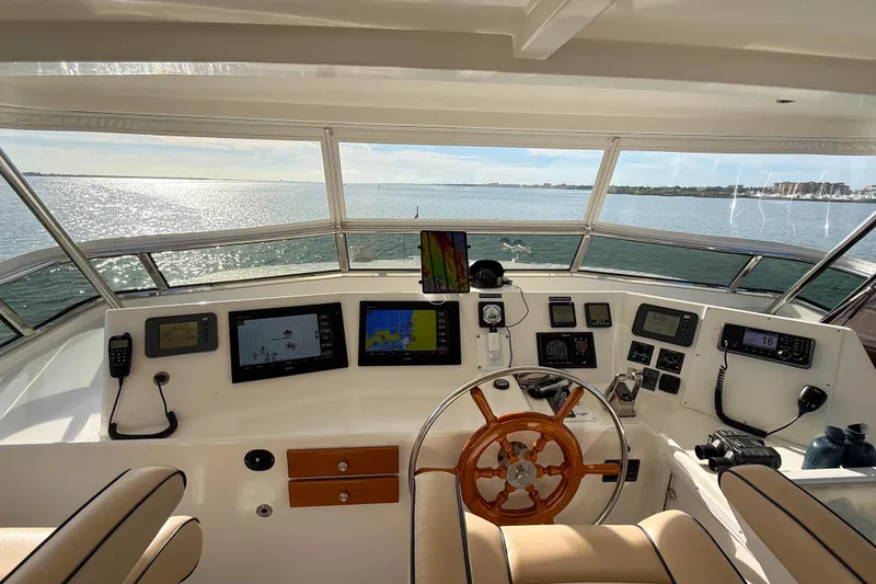 Slide: The Image of Wooden steering wheel on a 2003 Grand Banks 64 Aleutian RP yacht. - 31