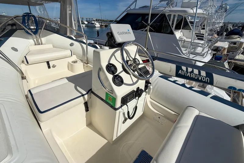 Slide: The Image of Inflatable boat on 2003 Grand Banks 64 Aleutian RP yacht, docked at marina. - 38