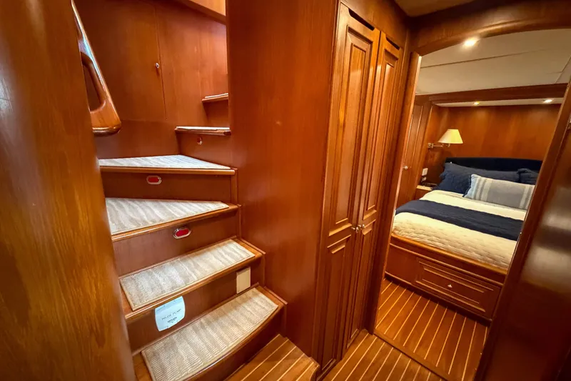 Slide: The Image of Luxurious 2003 Grand Banks 64 Aleutian RP yacht bedroom with elegant wood finish and cozy bedding. - 42