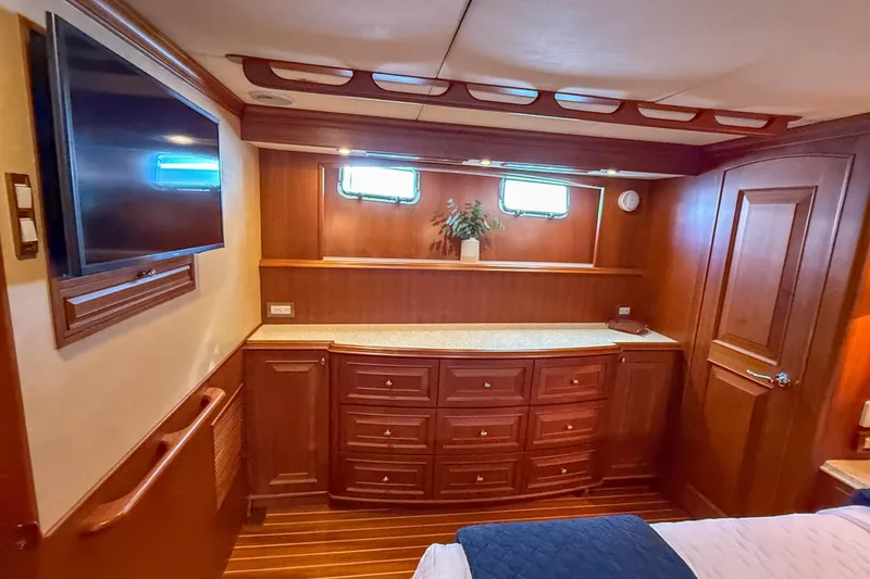 Slide: The Image of Luxurious cabin interior of 2003 Grand Banks 64 Aleutian RP yacht with wood finish. - 48