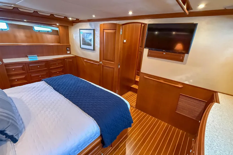 Slide: The Image of Luxurious bathroom on 2003 Grand Banks 64 Aleutian RP yacht with wood cabinetry and elegant fixtures. - 49