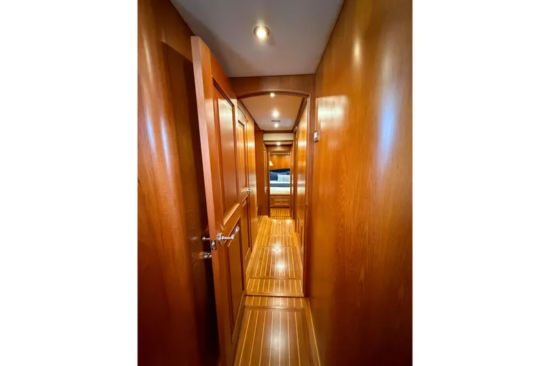 Slide: The Image of Luxurious interior of 2003 Grand Banks 64 Aleutian RP yacht with plush seating and elegant wood finishes. - 64