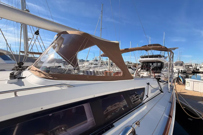 Slide: The Image of 2011 Jeanneau 53 sailboat docked at marina under clear blue sky. - 15