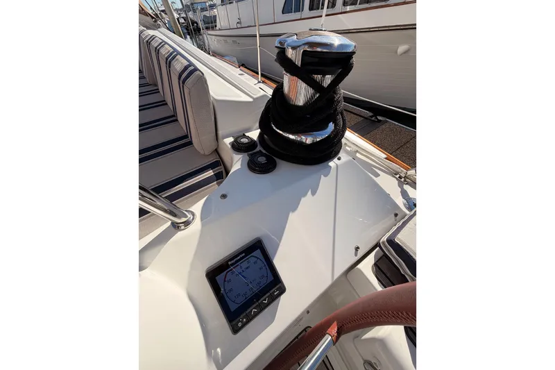 Slide: The Image of Cockpit of 2011 Jeanneau 53 sailboat with winch and navigation display. - 21