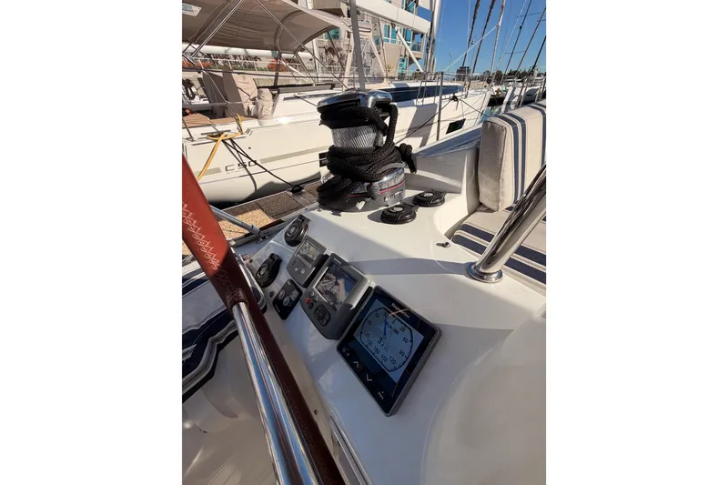 Slide: The Image of Cockpit view of 2011 Jeanneau 53 sailboat with navigation instruments and winch. - 23