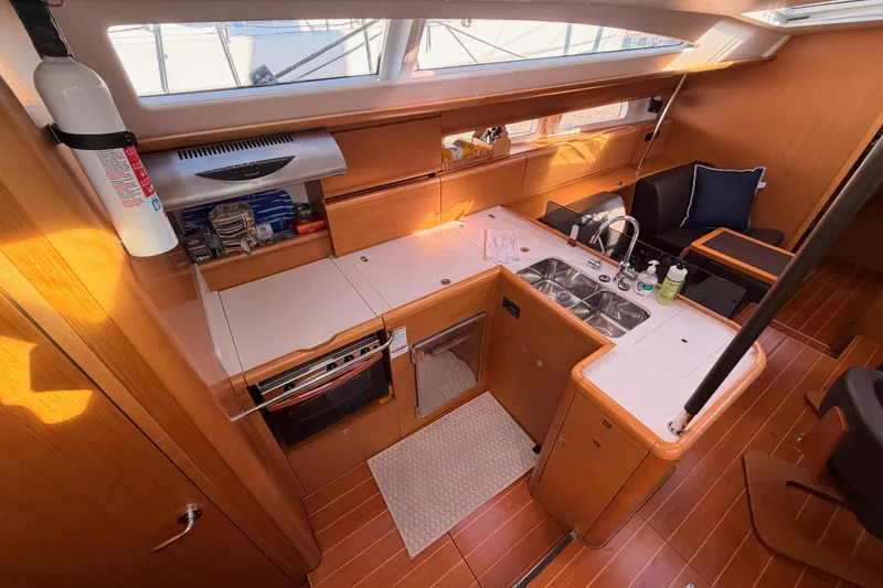 Slide: The Image of Luxurious 2011 Jeanneau 53 yacht interior with modern kitchen and seating area. - 41