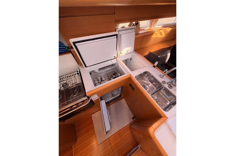 Slide: The Image of Luxurious 2011 Jeanneau 53 yacht kitchen with modern appliances and sleek design. - 46