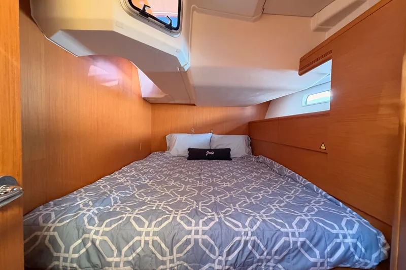 Slide: The Image of Cozy cabin interior of 2011 Jeanneau 53 sailboat with comfortable bedding. - 50