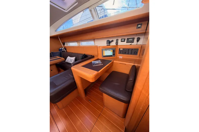 Slide: The Image of Interior of 2011 Jeanneau 53 yacht with navigation station and wooden finish. - 61