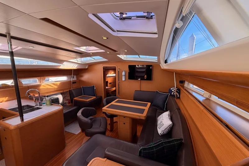 Slide: The Image of Luxurious interior of a 2011 Jeanneau 53 yacht with elegant wood finishes and modern amenities. - 63