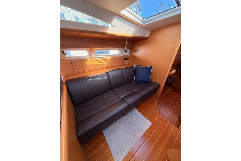 Slide: The Image of Interior of 2011 Jeanneau 53 yacht with leather sofa and skylight. - 67