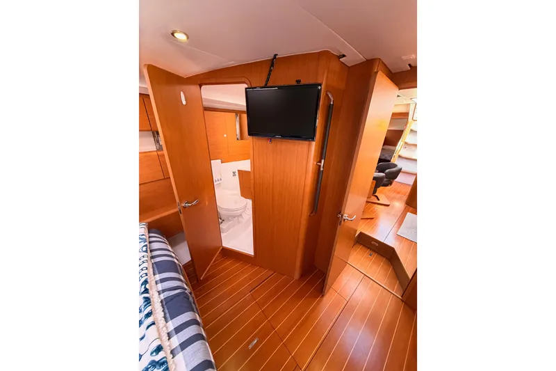 Slide: The Image of Interior of 2011 Jeanneau 53 yacht with wood finish and modern amenities. - 74