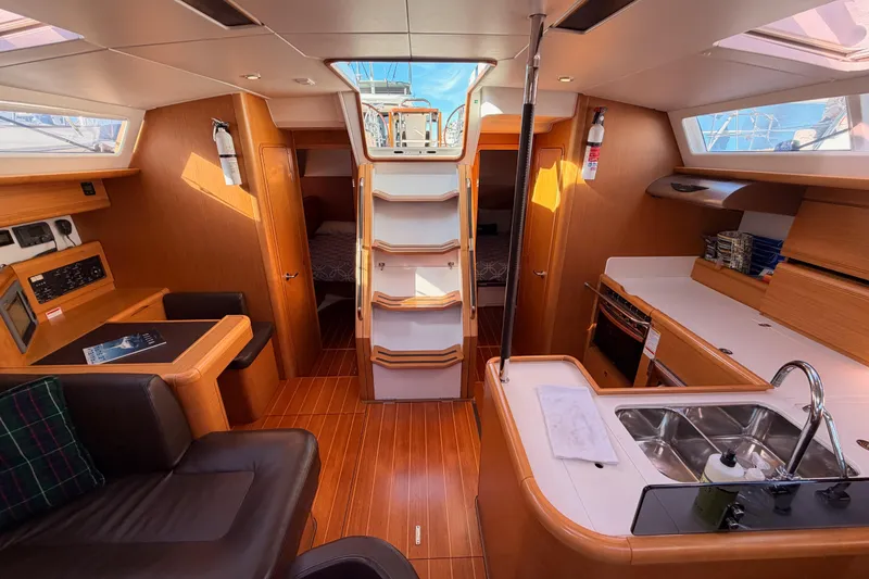 Slide: The Image of Interior of 2011 Jeanneau 53 yacht with modern kitchen and seating area. - 82