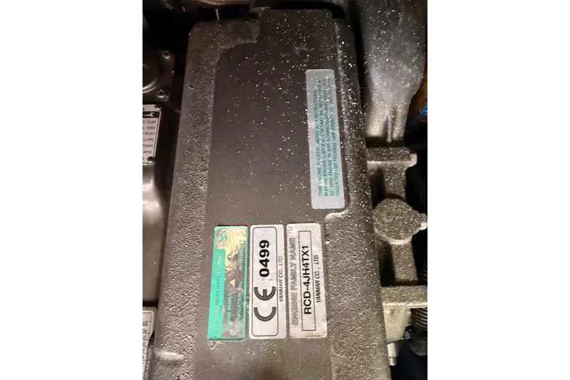 Slide: The Image of Engine compartment of a 2011 Jeanneau 53 sailboat, featuring Yanmar engine details. - 85