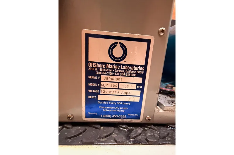 Slide: The Image of Label on marine equipment from Offshore Marine Laboratories, model SQF 200, 12VDC/15 Amps. - 89