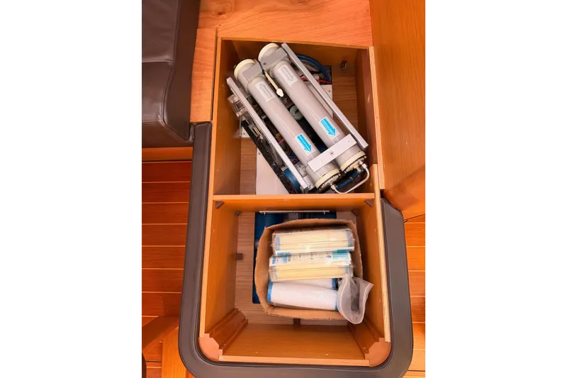 Slide: The Image of Storage compartment on 2011 Jeanneau 53 yacht with equipment and supplies. - 90