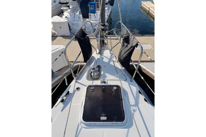 Slide: The Image of Bow view of 2007 Beneteau 49 sailboat docked at marina. - 18