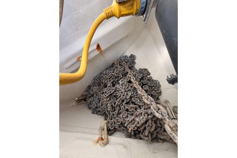 Slide: The Image of Anchor chain and rope in a 2007 Beneteau 49 sailboat compartment. - 22
