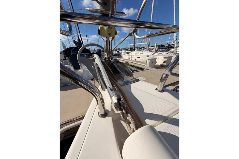 Slide: The Image of 2007 Beneteau 49 yacht deck with stainless steel railings and marina view. - 23