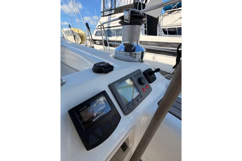 Slide: The Image of Control panel on a 2007 Beneteau 49 sailboat, featuring navigation instruments and winch. - 38
