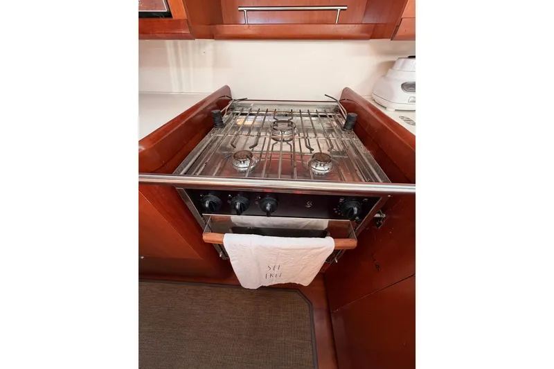 Slide: The Image of Galley kitchen in 2007 Beneteau 49 yacht with stove and oven. - 54