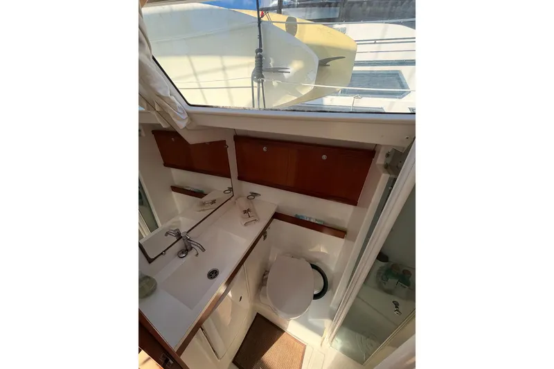 Slide: The Image of Bathroom interior of 2007 Beneteau 49 yacht with sink and toilet. - 64