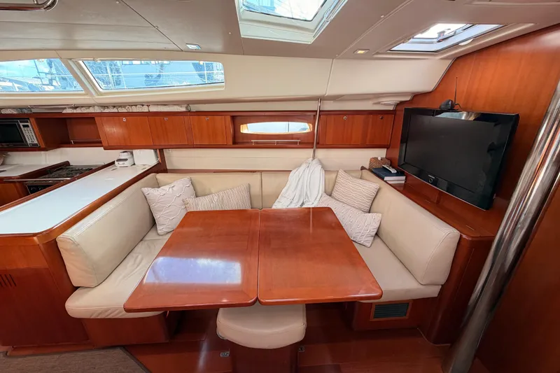 Slide: The Image of Luxurious interior of 2007 Beneteau 49 yacht with dining area and TV. - 79