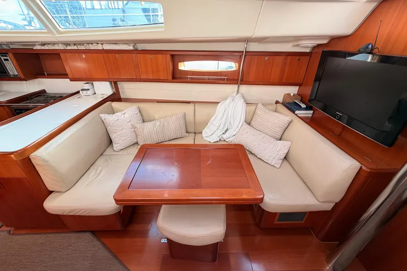 Slide: The Image of Luxurious interior of a 2007 Beneteau 49 yacht with cozy seating and modern amenities. - 80