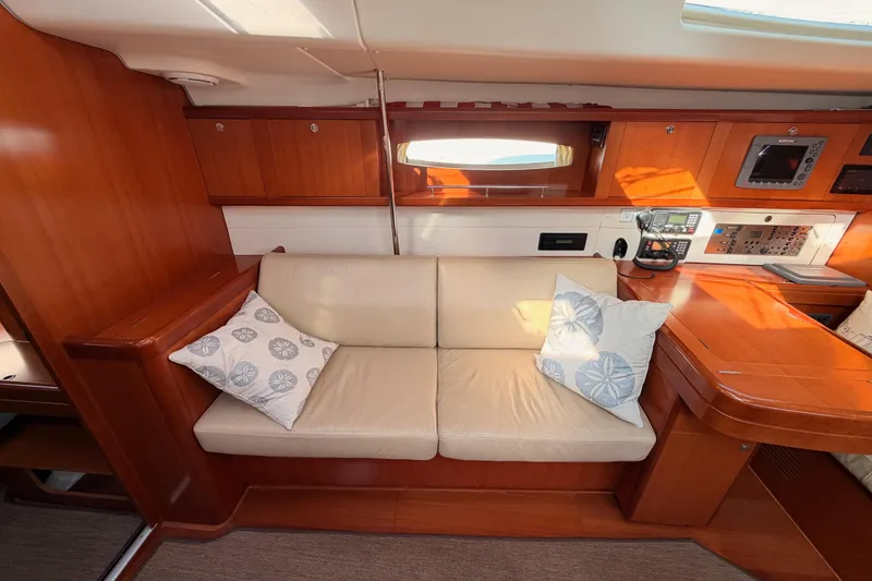Slide: The Image of Interior of 2007 Beneteau 49 yacht with beige sofa and wooden cabinetry. - 81