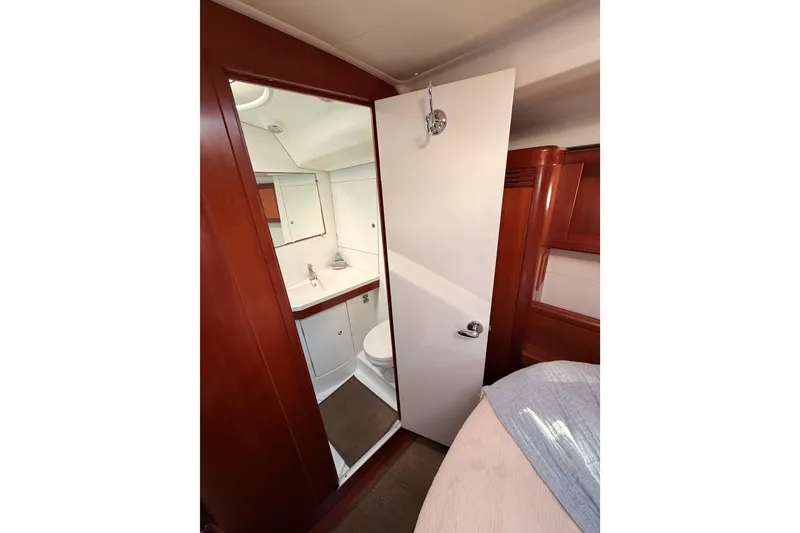 Slide: The Image of Interior view of 2007 Beneteau 49 yacht bathroom with wooden accents and modern fixtures. - 87