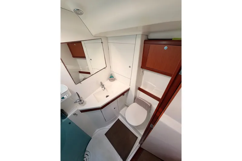 Slide: The Image of 2007 Beneteau 49 yacht bathroom with modern fixtures and wood accents. - 88